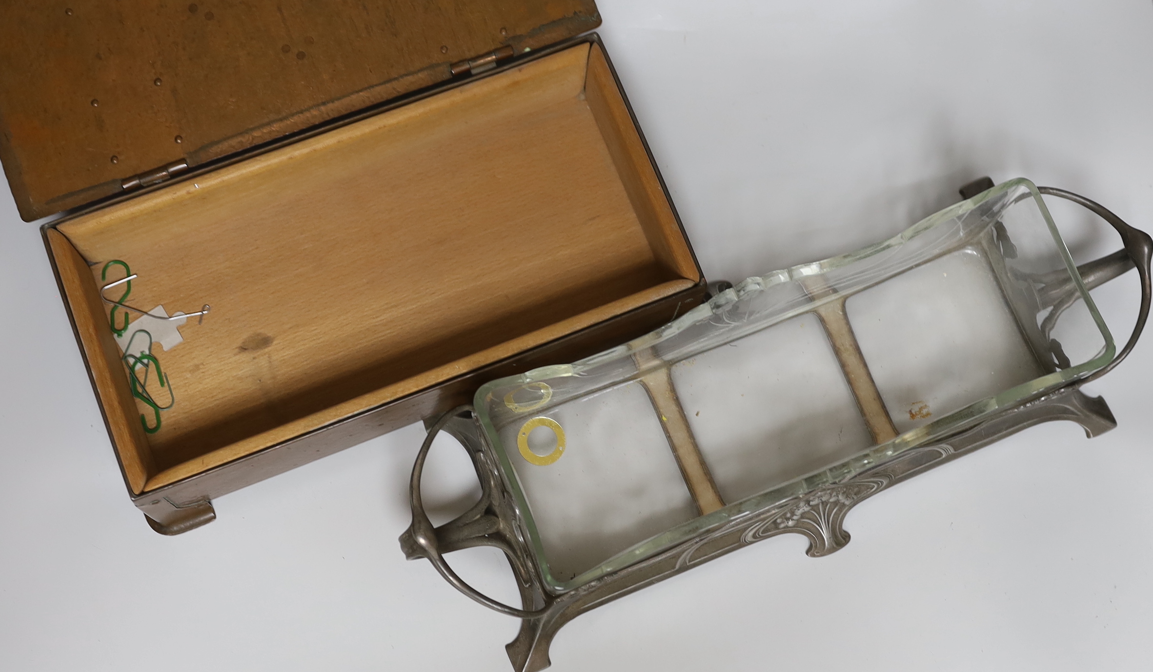 An Arts and Crafts copper box, the lid inset with a Ruskin porcelain plaque and an Art Nouveau pewter mounted glass centrepiece dish, 41 cm wide